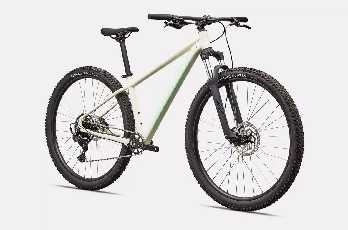 White Specialized Rockhopper Sport mountain bike on a light gray background