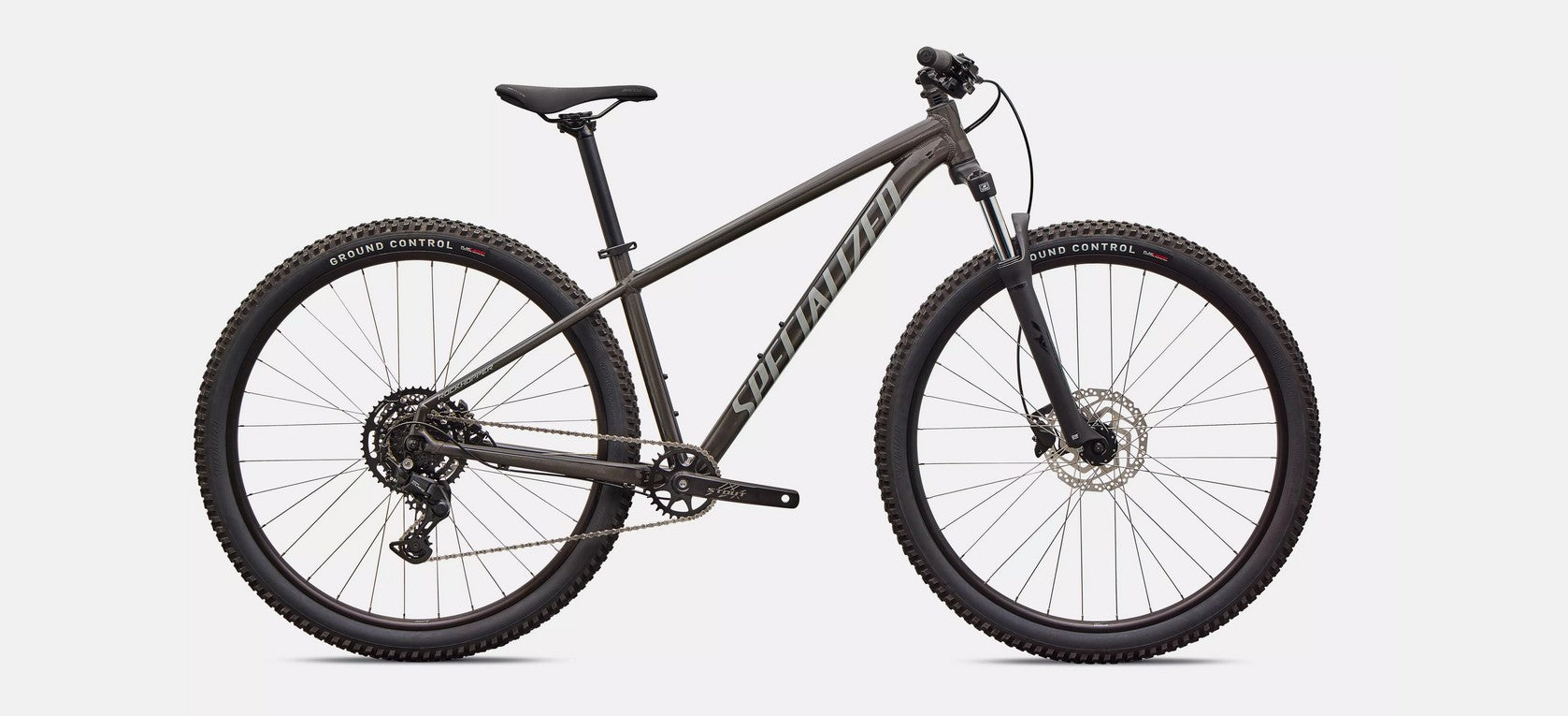Profile of dark grey Specialized Rockhoper Sport mountain bike on a white background