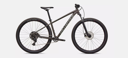 Profile of dark grey Specialized Rockhoper Sport mountain bike on a white background