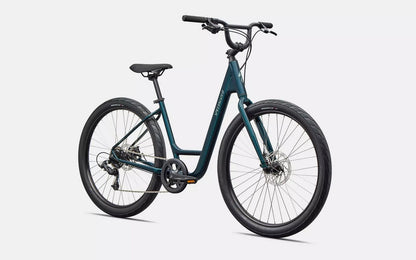 Front right profile view of emerald green  Specialized Roll bicycle on white background.