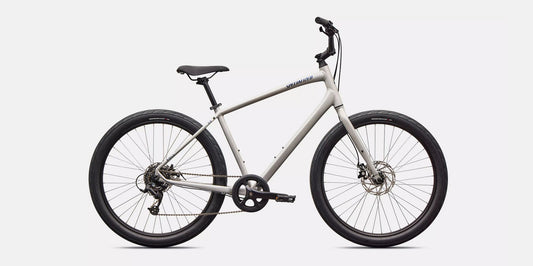 Right profile of white Specialized Roll bicycle with blue lettering and black components on a white background.