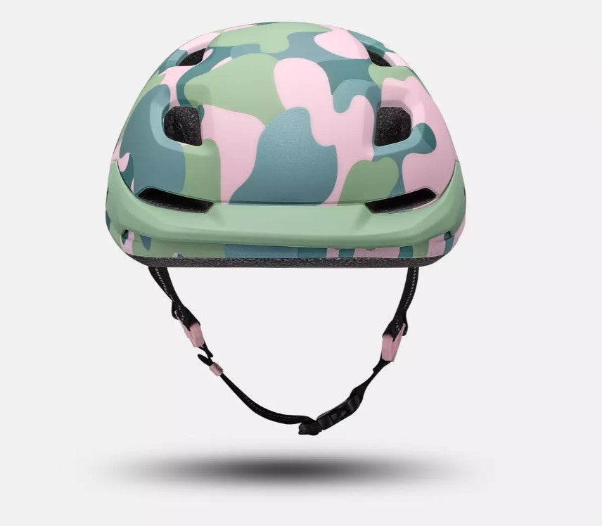 Front view of a pink and green camouflage patterned Specialized Shuffle LED 2 child's bicycle helmet on a white background. 