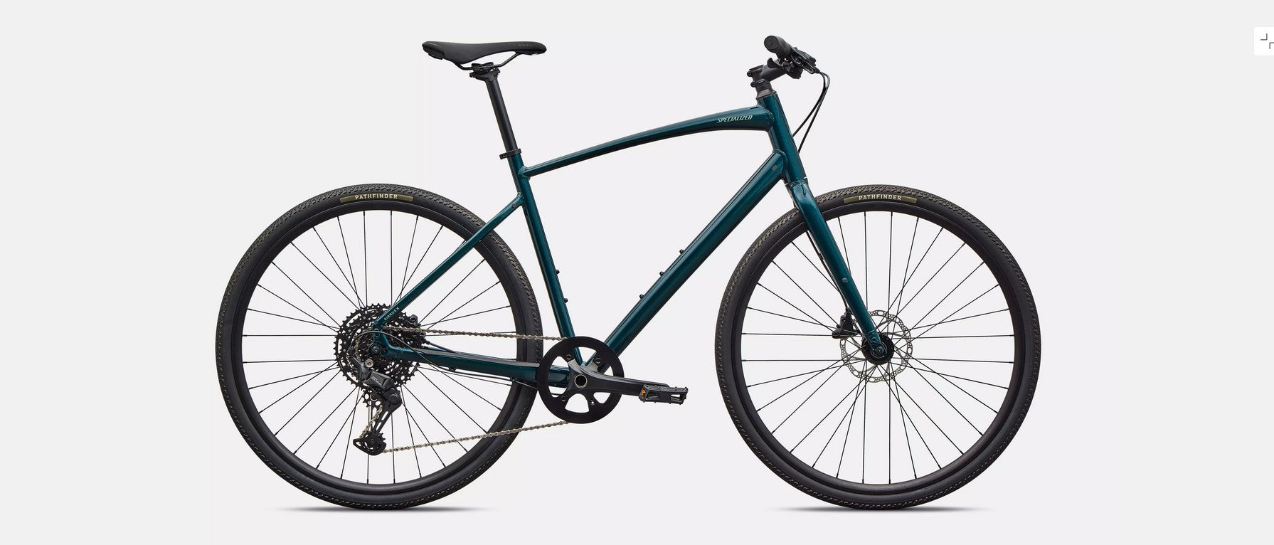Right profile of emerald green Specialized Sirrus X bicycle  with black components on a light gray background