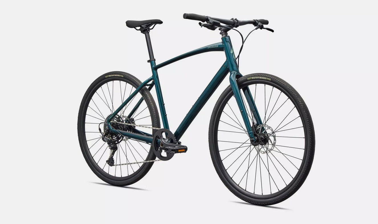 Front right profile view of emerald green Specialized Sirrus X bicycle with black components on a white background