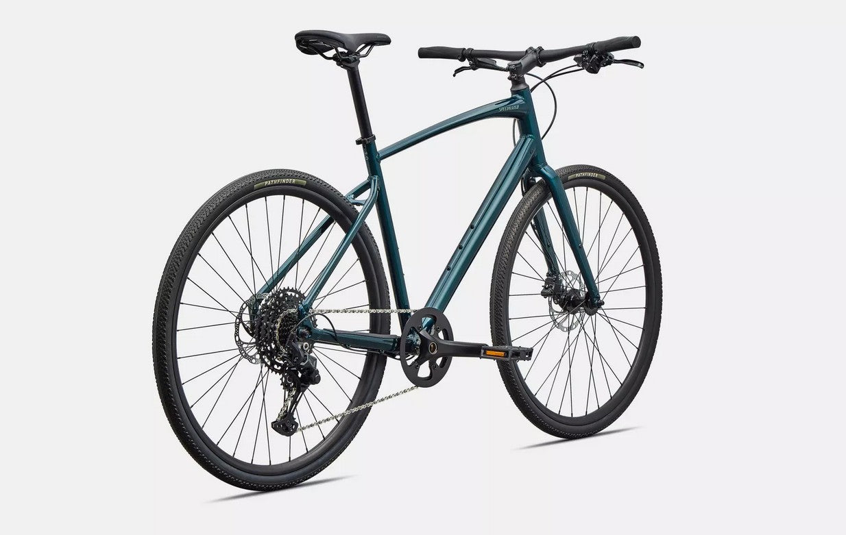 Back right view of emerald green Specialized Sirrus X bicycle with black components on a white background