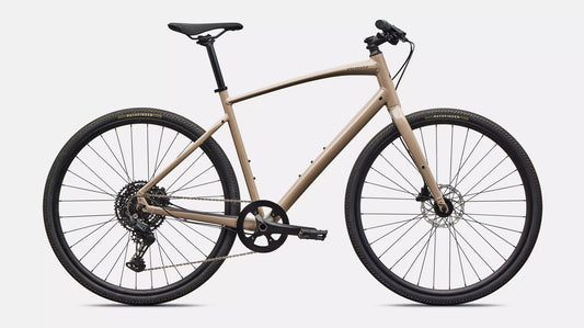 Right profile of beige Specialized Sirrus X bicycle with black components  on a white background