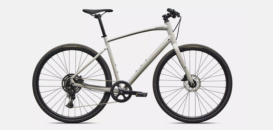 Right profile view of white Specialized Sirrus X bicycle with black components on a white background. 