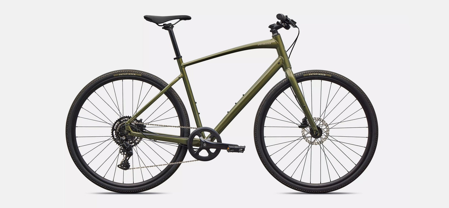 Right profile view of an olive green Specialized Sirrus X bicycle with black components on white background. 