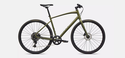 Right profile view of an olive green Specialized Sirrus X bicycle with black components on white background. 