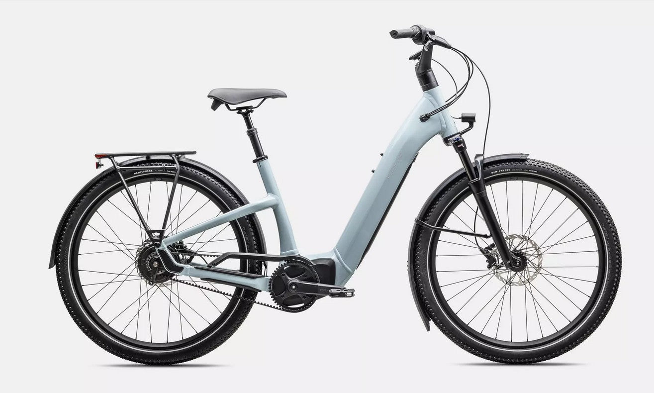 Light blue Specialized Turbo Como electric bicycle with black components on a white background
