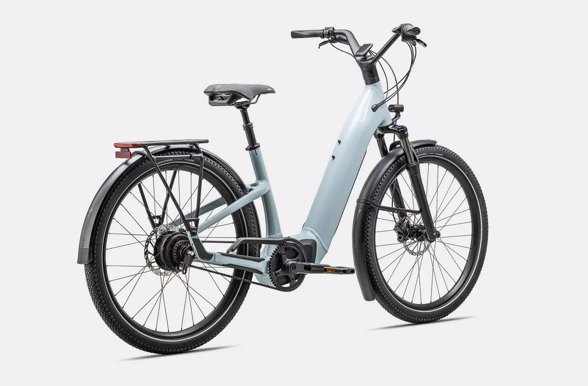 Light blue Specialized Turbo Como electric bicycle with black components on a white background