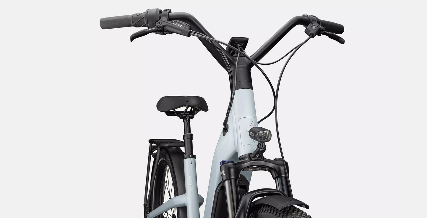 Specialized Turbo Como Electric bike with a light blue frame and black components on a white background