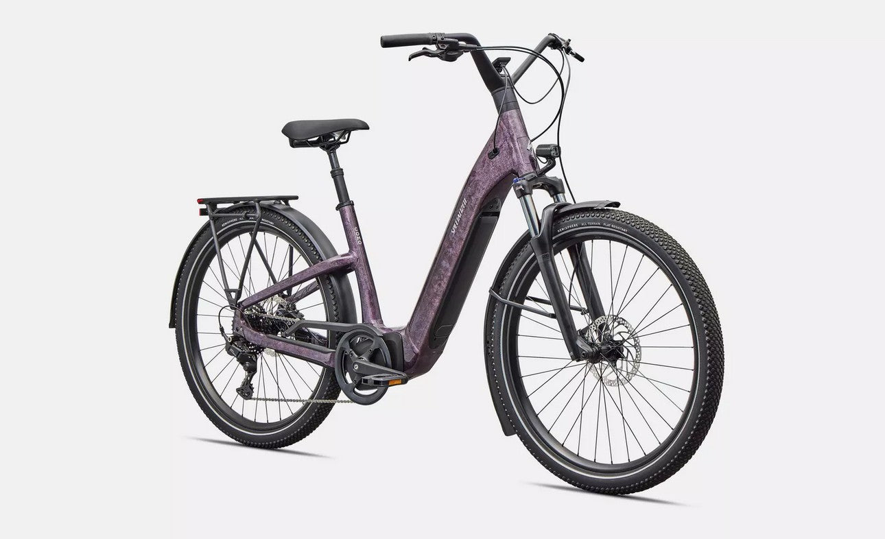 Front right profile view of purple Specialized Turbo Como electric bicycle on a white background