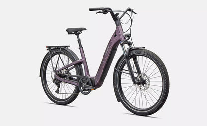 Front right profile view of purple Specialized Turbo Como electric bicycle on a white background
