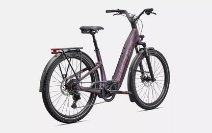 Back right profile view of purple Specialized Turbo Como electric bicycle with black components on a white background