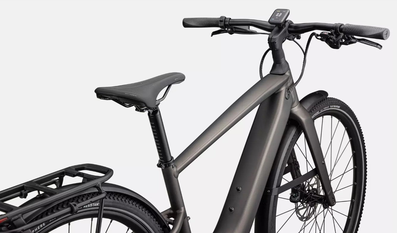 Close up of dark gray Specialized Vado SL electric bicycle with black components with a white background