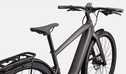 Close up of dark gray Specialized Vado SL electric bicycle with black components with a white background
