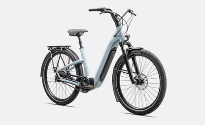 Light blue Specialized Turbo Como electric bicycle with black components on a white background.