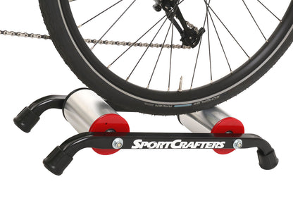 This is a side view of the SportCrafters Trike Trainer Double Overdrive, shown with a trike mounted, on a white background.