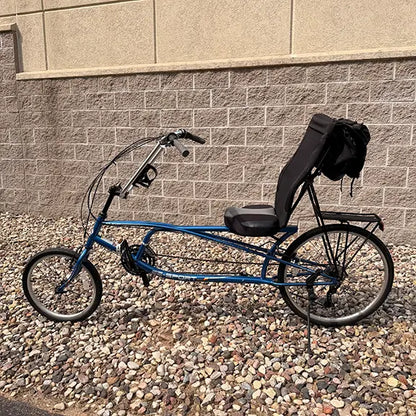 Non-drive side view of the Sun Seeker Used EZ-Sport CX 26-20 Lemans Blue Recumbent Bike in an outdoor setting.