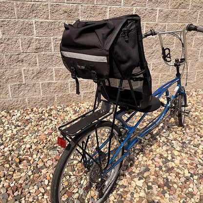 Closeup view of the seat bag and rear rack on the Sun Seeker Used EZ-Sport CX 26-20 Lemans Blue Recumbent Bike in an outdoor setting.