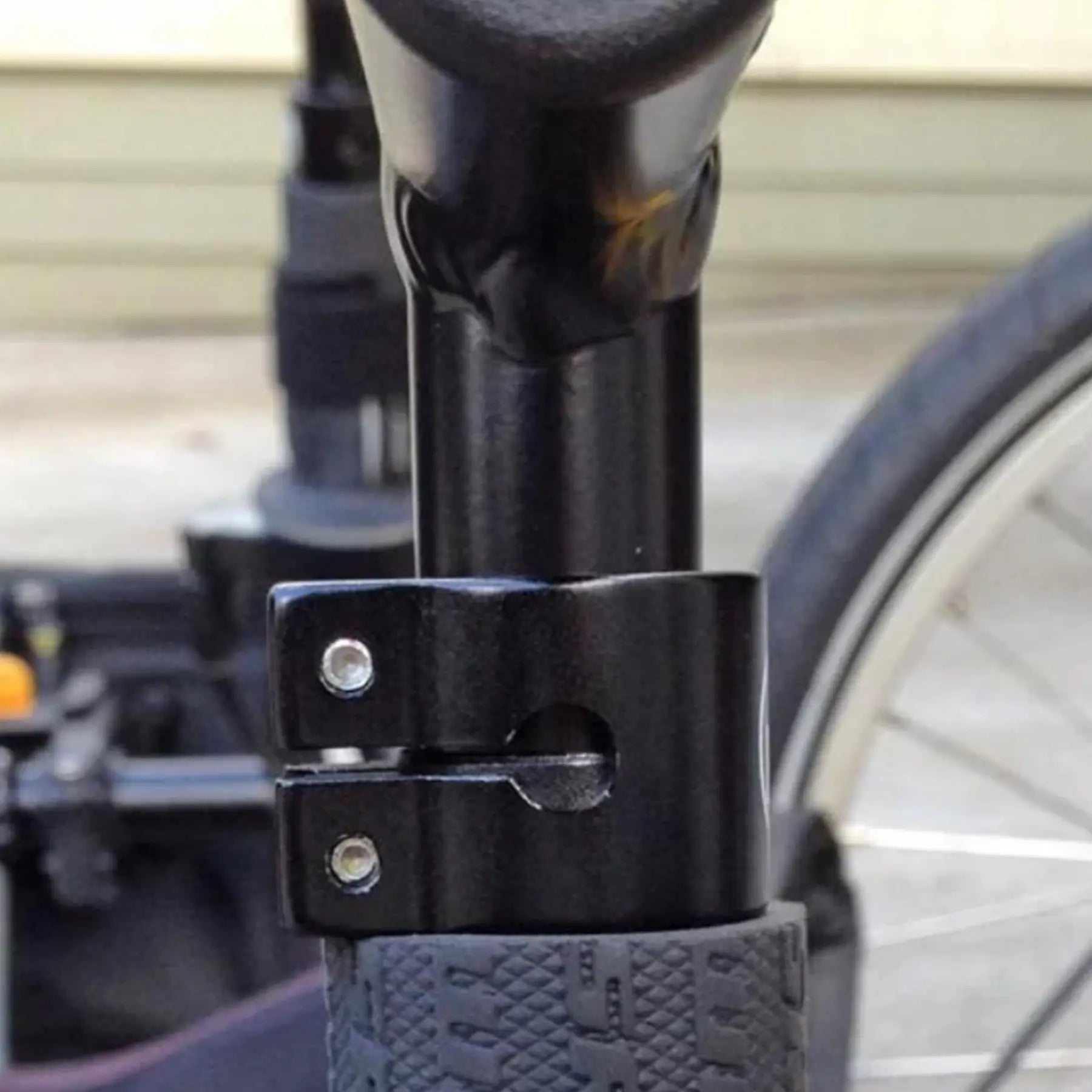 Closeup view of the clamp on the T-Cycle Cockpit Mini T 3.75 inch without cable hole mounted on a recumbent trike handlebar.