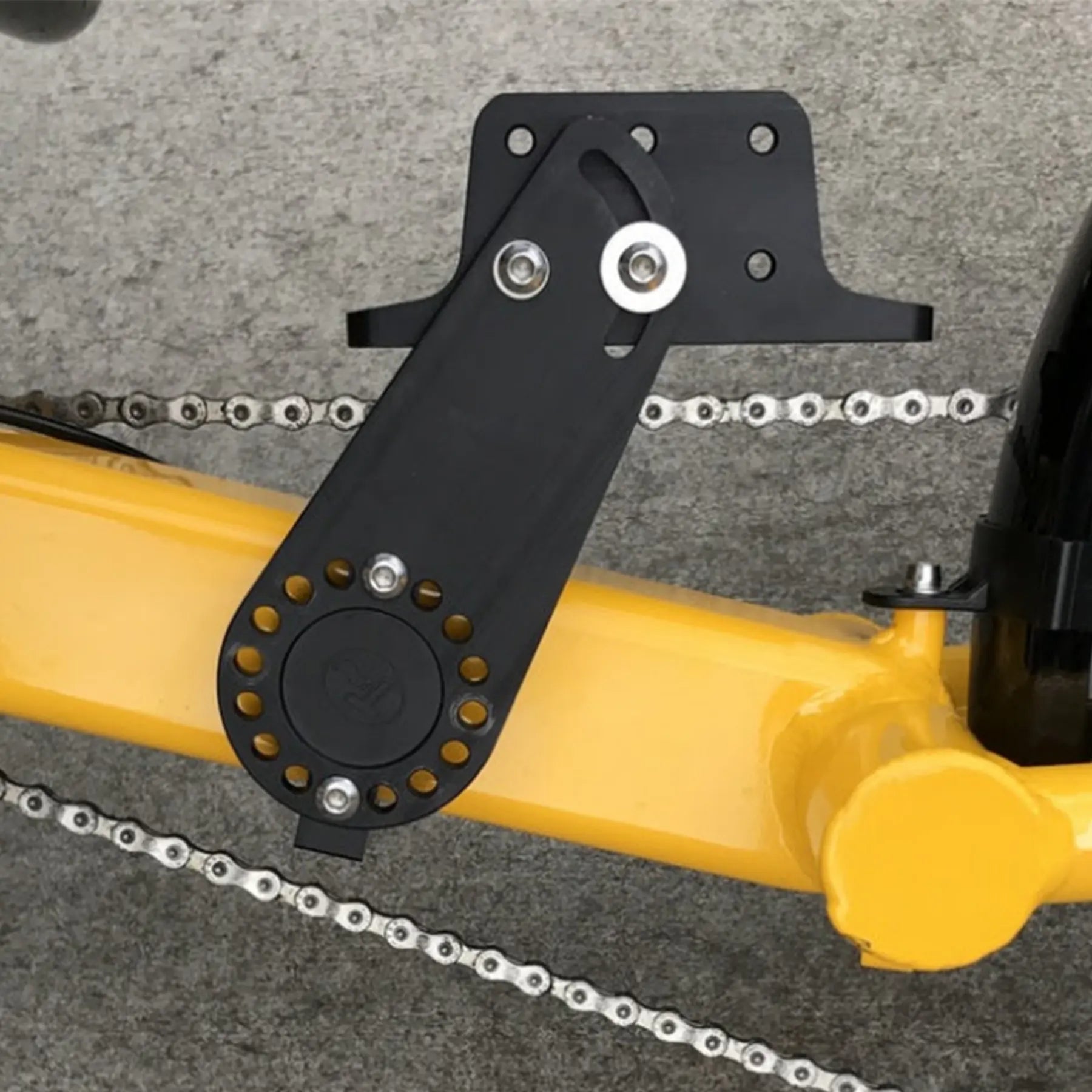 Closeup view of the T-Cycle Configurable Battery Mount mounted on an Greenspeed GT20 against a grey background.