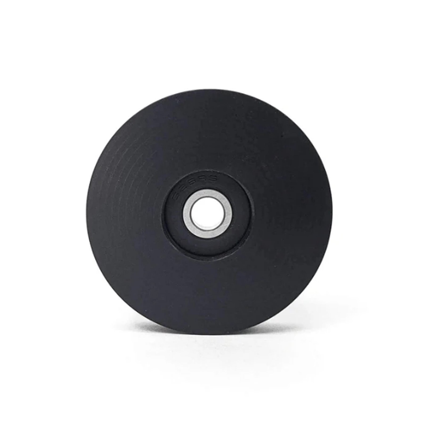 Side view of the T-Cycle Delrin Mini Idler for Tensioners and Volae in black against a white background.