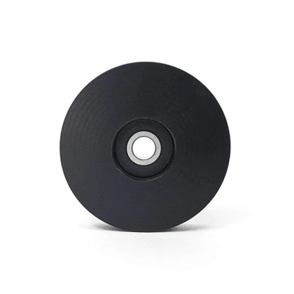 Side view of the T-Cycle Delrin Mini Idler for Tensioners and Volae in black against a white background.