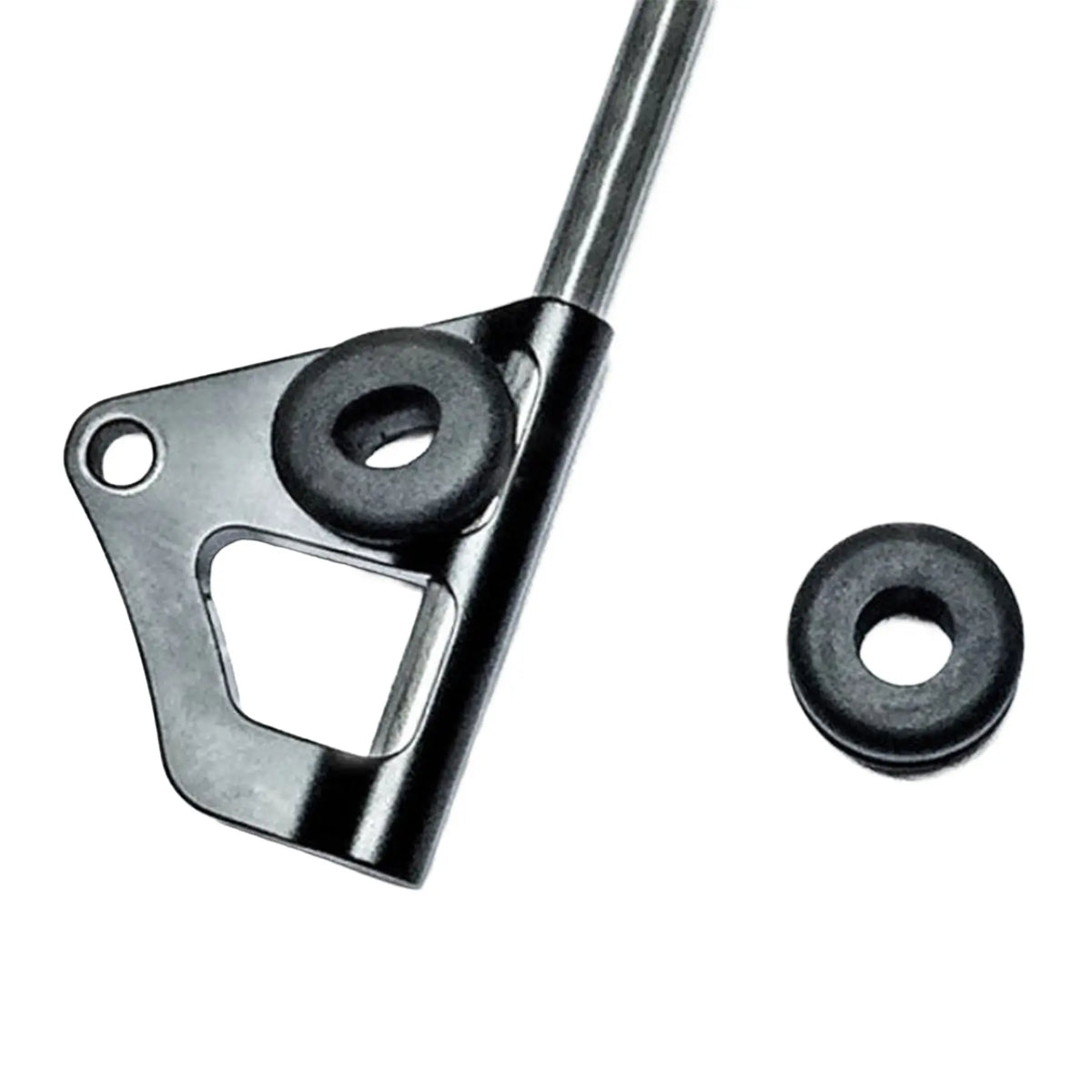 Side view of the T-Cycle Flag Grommet For Catrike Flag Mount in black mounted on a Catrike Flag mount, with a second grommet sitting to the side, against a white background.