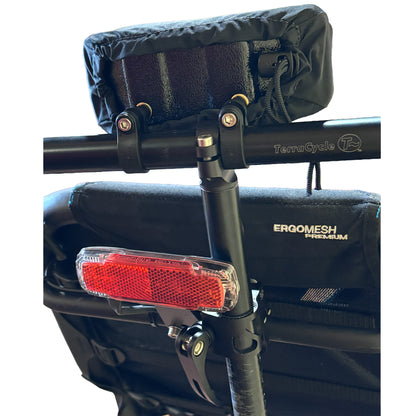 Back view of the T-Cycle Finer Recliner Medium Neckrest Kit for HP Velotechnik ErgoMesh Premium Seats mounted on a recumbent trike seat against a white background.