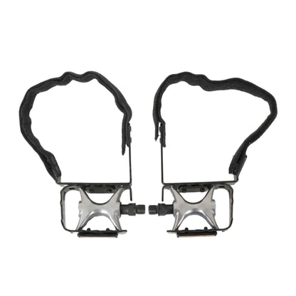 View of the TerraTrike Comfort Pedal Conversion Kit Pair installed on a black and silver pedal set against a white background.