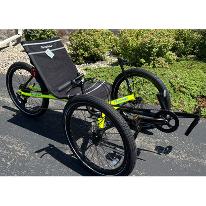 Angled view of the Terratrike Demo Rambler Recumbent Trike in Salted Grass in an outdoor setting.