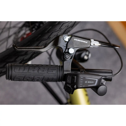 Closeup view of the Bosch controller on the TerraTrike E.V.O. Proton Green Recumbent Trike against a gray background.