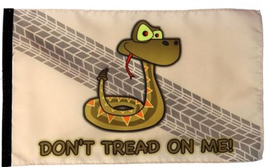The TerraTrike Flag Extension pictures a coiled snake with his tongue flicking out, with the words "Don't Tread On Me! underneath the snake. The flag features a tan background with a tire tread, and a black velcro strip on the left side of the flag.