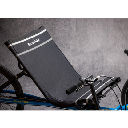 Closeup view of the seat on the TerraTrike Maverick Eiffel Blue Recumbent Trike against a grey background.