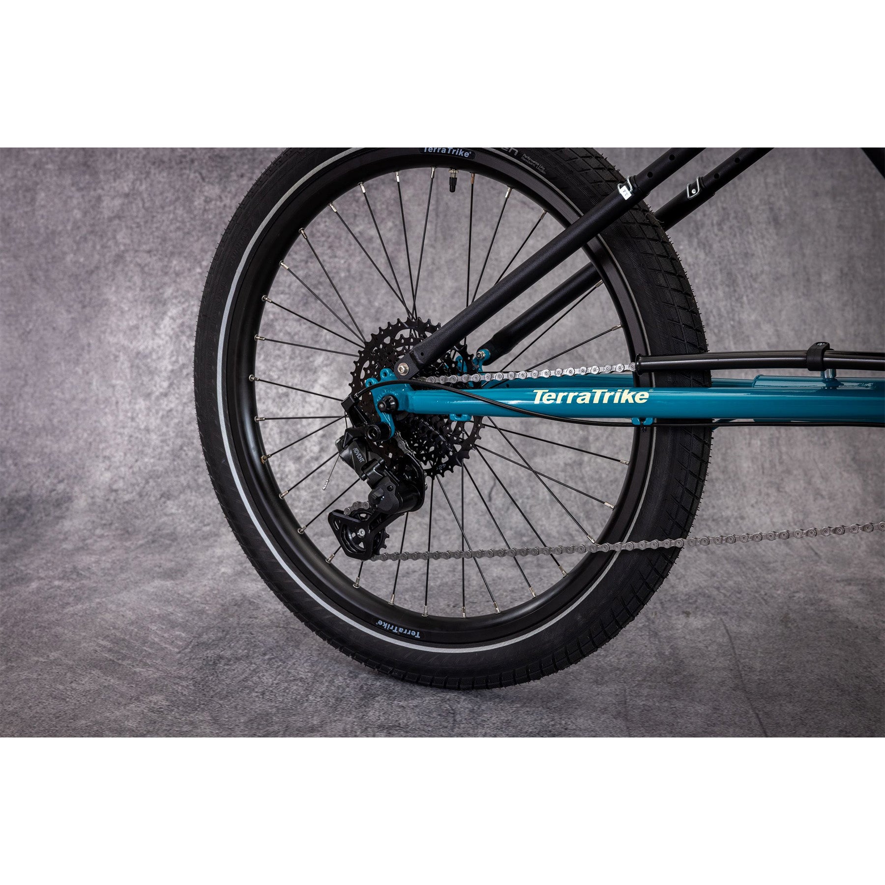 Closeup of the rear wheel on the Terratrike Rambler Recumbent Trike in Gemstone. 