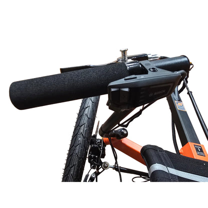 Closeup view of the Performance Line Bosch controller and left handlebar on the TerraTrike Rover Tandem e-Plus Habanero Recumbent Trike against a white background.