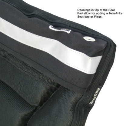 Top view of the black TerraTriike Seat Pad Cushion against a white background with text talking about the seat bag and flag holes.