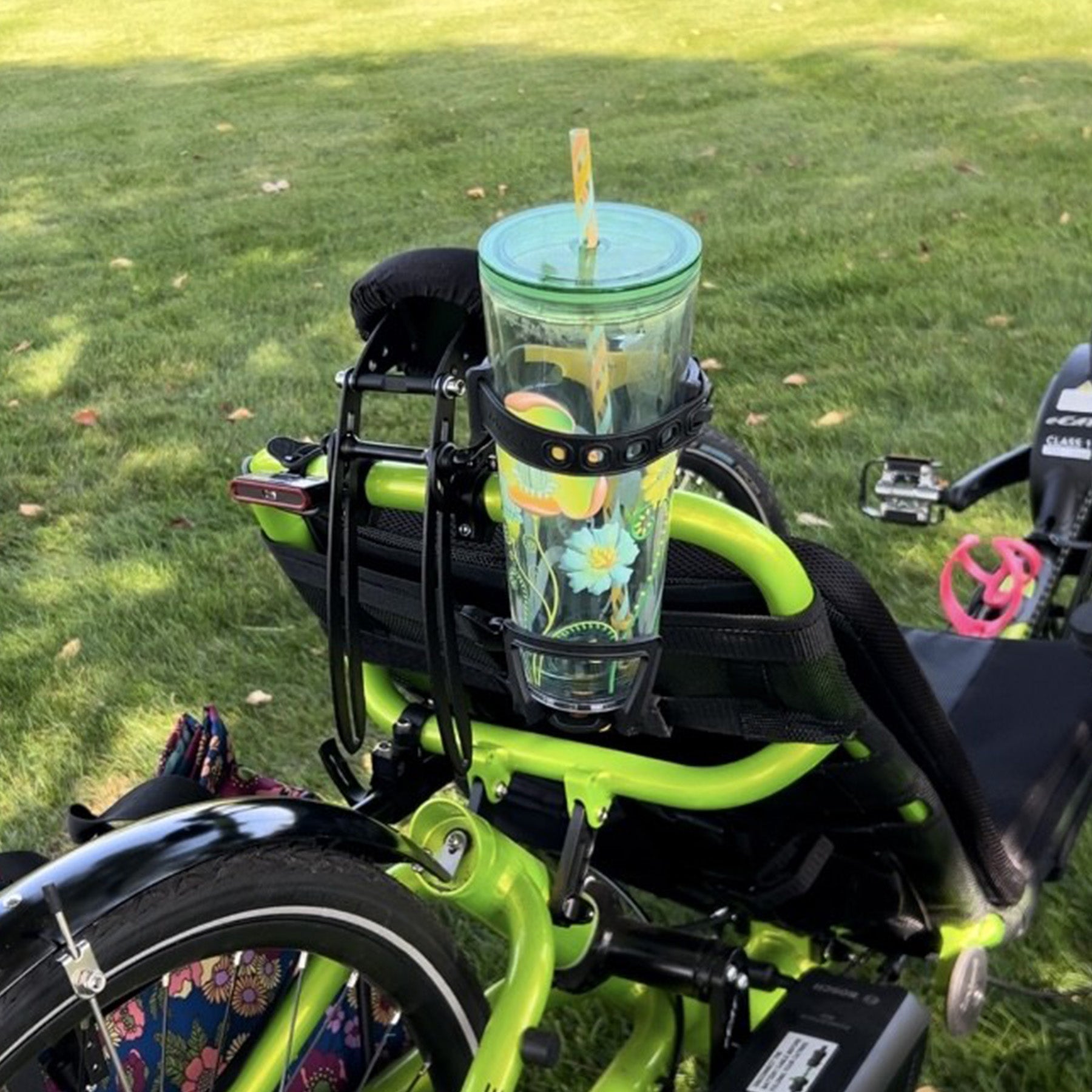 The Topeak Modula™ Java bottle cage mounted on the back of a recumbent trike using a bottle cage mount.