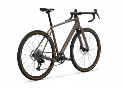 Angled view of a bronze Trek Checkpoint ALR 5 with black components on a white background. 
