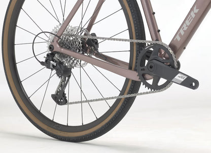 Close-up of a bronze Trek Checkpoint ALR 5 drivetrain on a white background