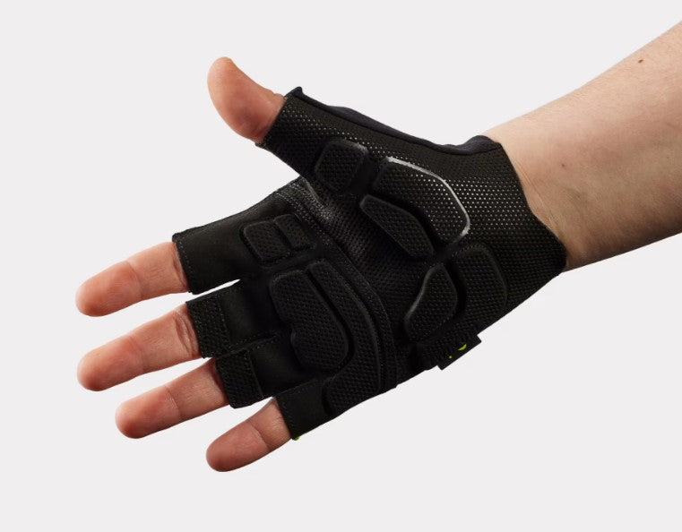 Black Trek Circuit Twin gel half-finger glove on a person's hand against a white background