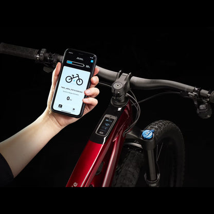 Closeup of the smartphone app for a Trek Fuel Exe 8GX AXS mountain bike on a black background.