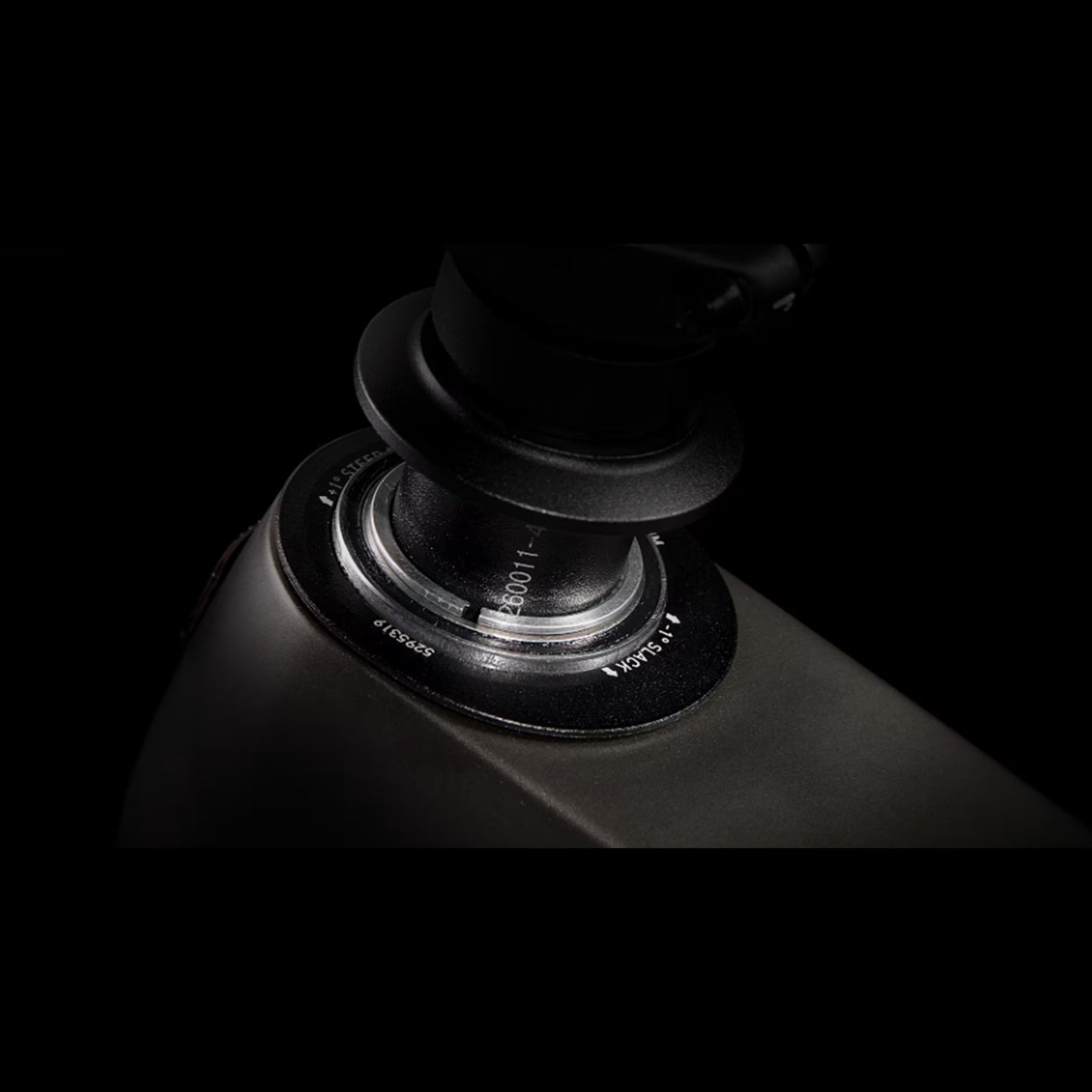 Closeup of the headset cups on a Trek Fuel Exe 8GX AXS mountain bike on a black background.