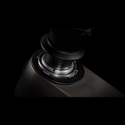 Closeup of the headset cups on a Trek Fuel Exe 8GX AXS mountain bike on a black background.