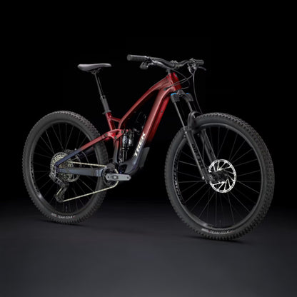 Rage red to deep dark blue fade Trek Fuel Exe 8GX AXS mountain bike on a black background.