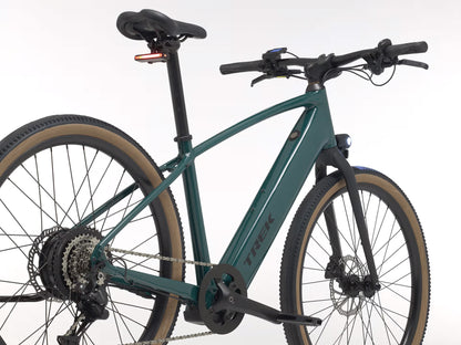 Rear quarter view of the Trek FX+ 1 Juniper e-Bike, shown on a white background.