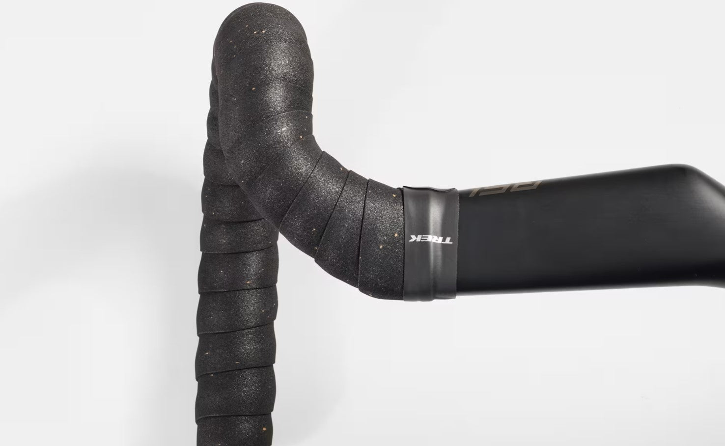 Close-up of a black Trek gel cork bicycle handlebar tape with 'Trek' branding on a white background.
