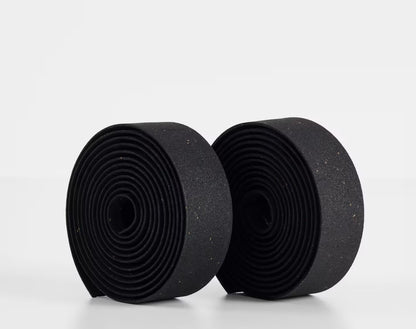 Two rolls of black Trek gel cork bicycle handlebar tape on a white background.